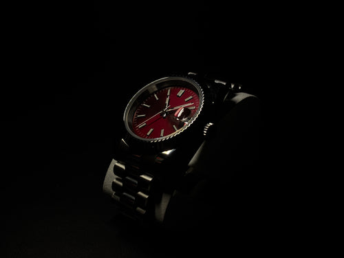 Elusivy luxury watch in dark with chrome red dial